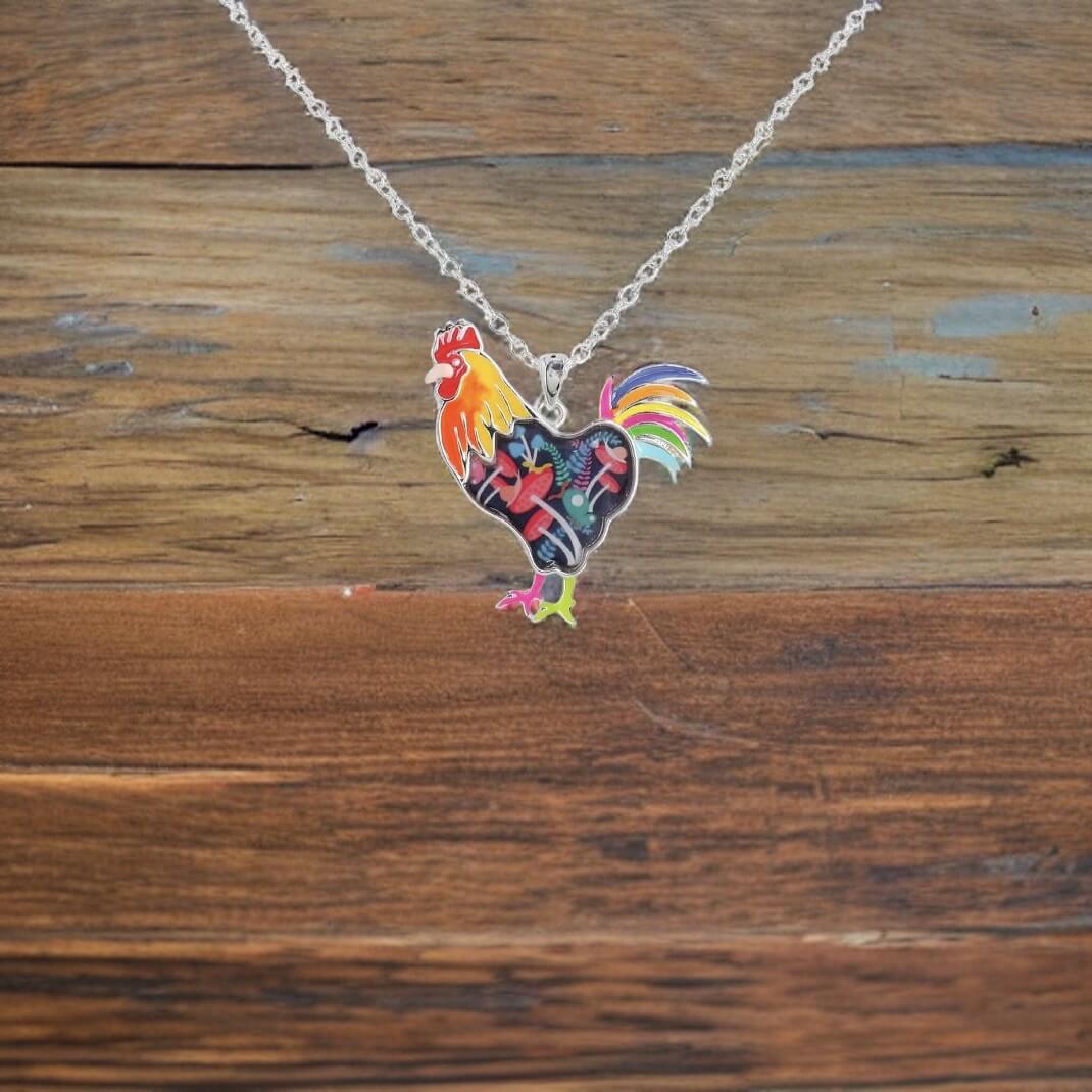 Multi coloured enamel rooster necklace with 24" adjustable chain.