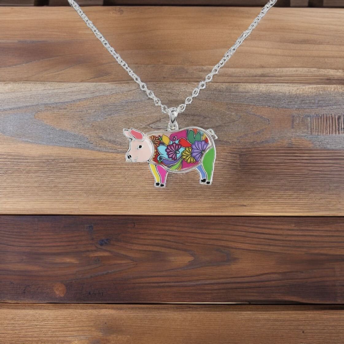 Multi coloured enamel pig necklace with 24" adjustable chain.