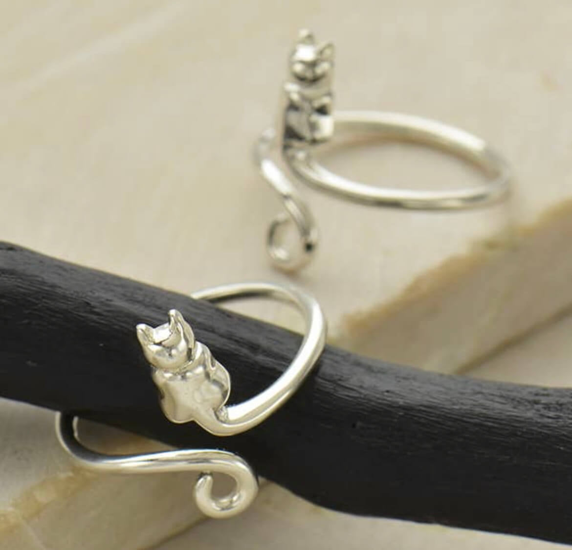 Sterling silver adjustable cat ring.  Adorable cat and tail wrap around your finger.